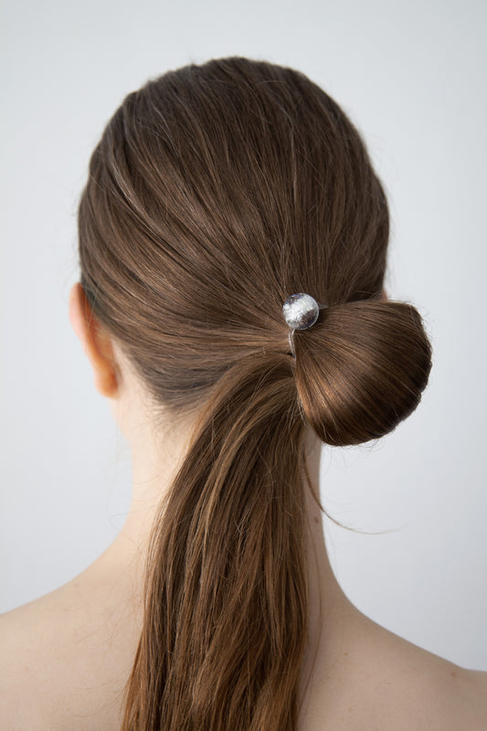 Sculpted ponytail worn with MERKURA minimal high-quality designer hair tie