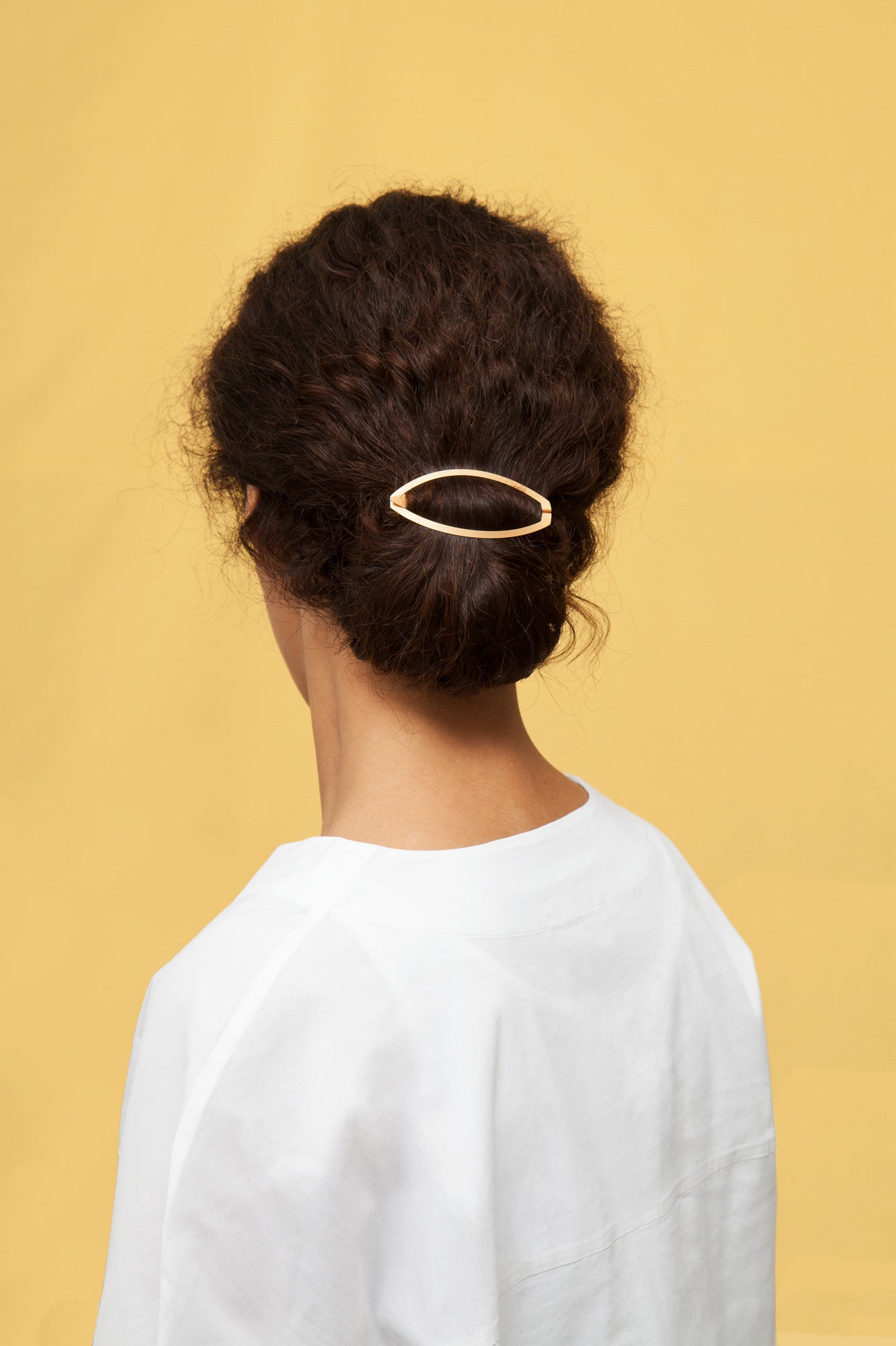 A neat low knot secured with the ALVA designer hairclip. Made from high quality materials designed to last